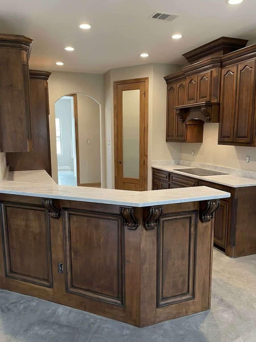 Professionally painted white kitchen cabinets by SATX Painters